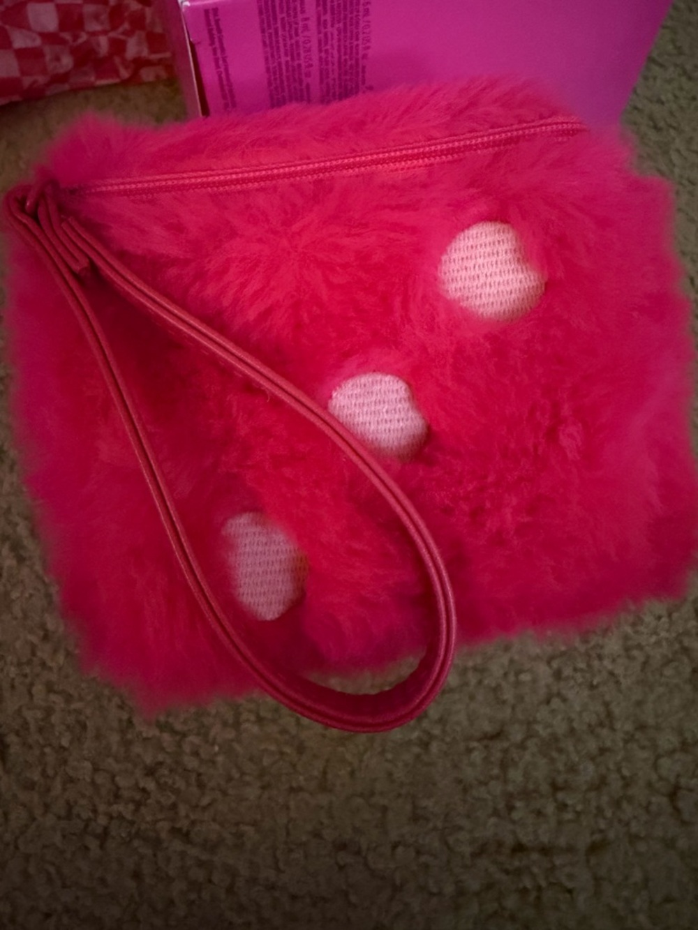 Benefit fuzzy dice wristlet